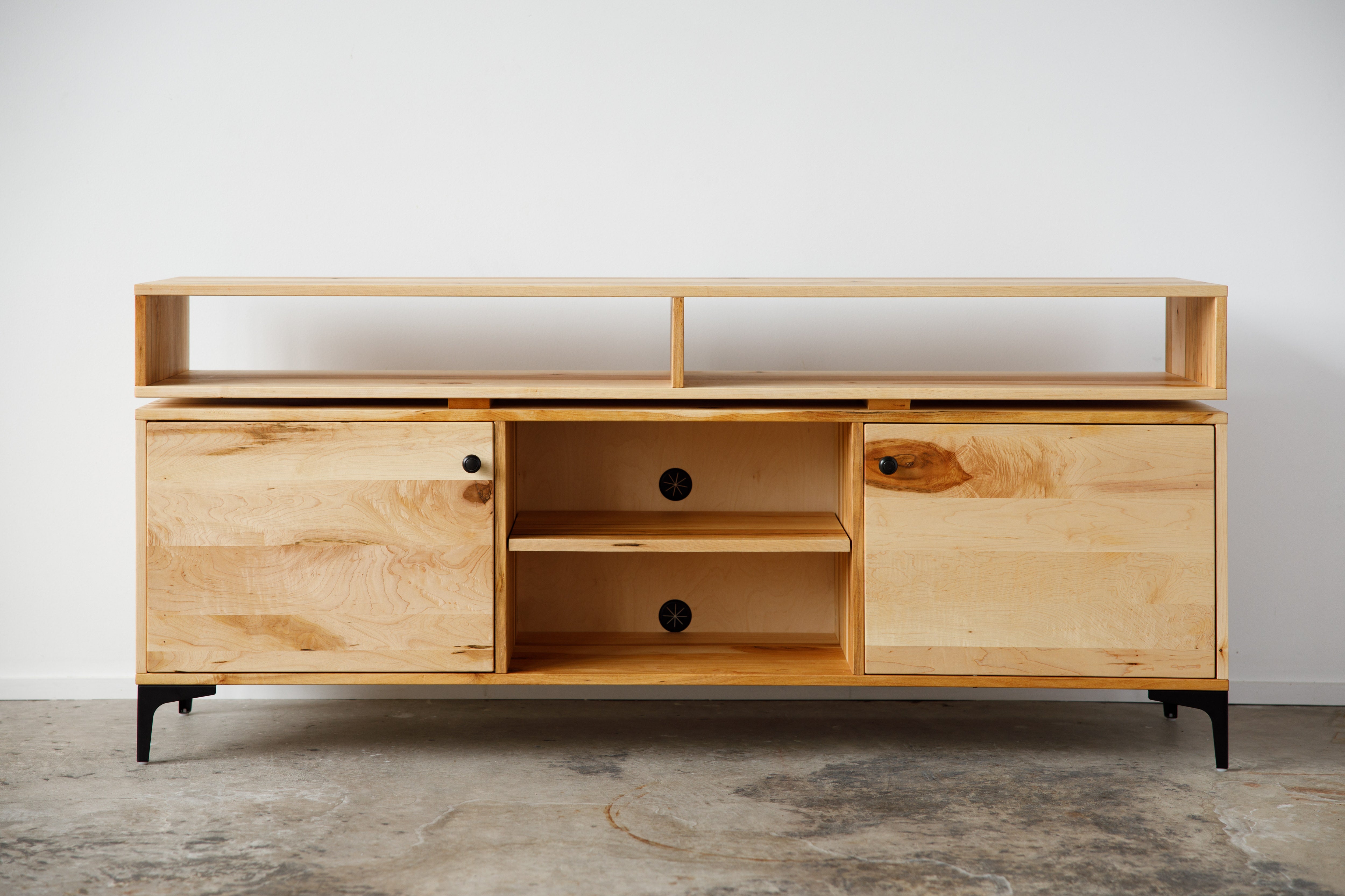 wooden entertainment center with floating top shelves and cabinets